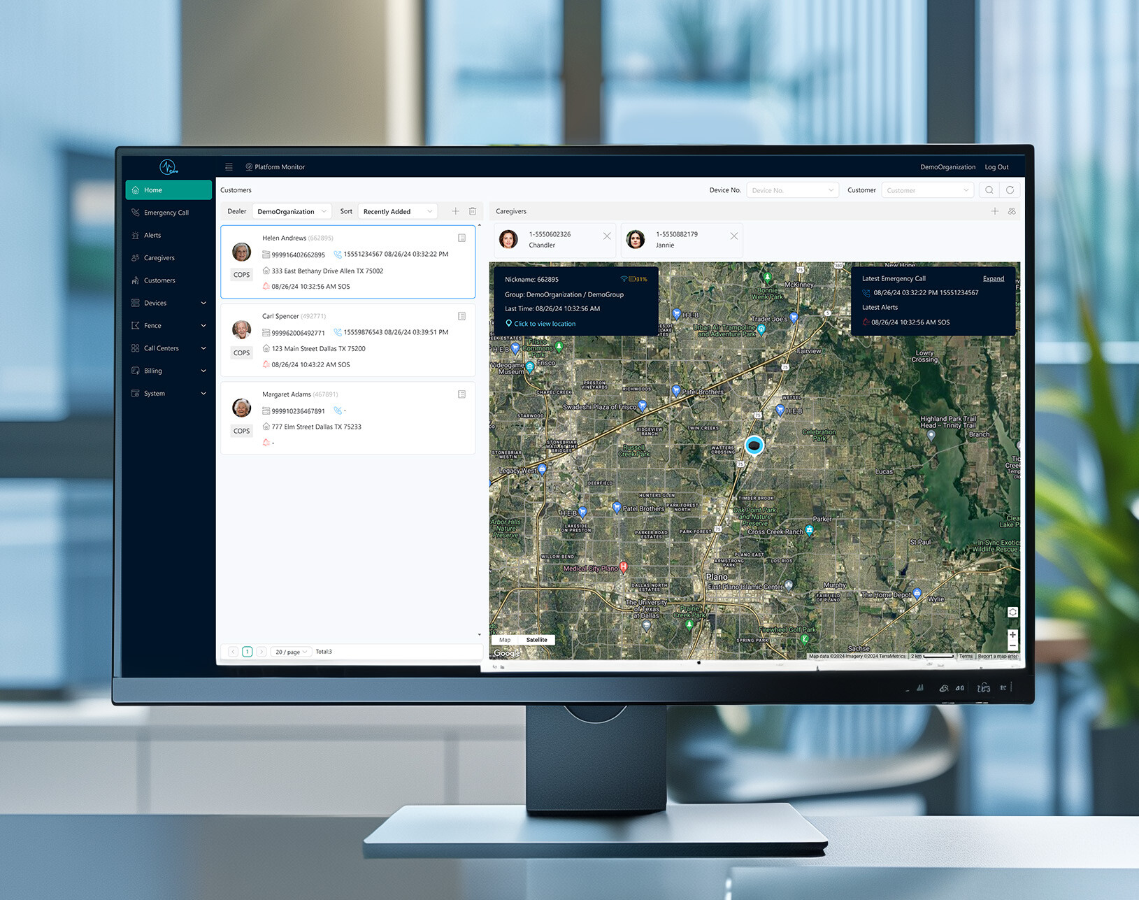 Computer monitor on a desk showing a geographical map tracking different users in the VCare platform